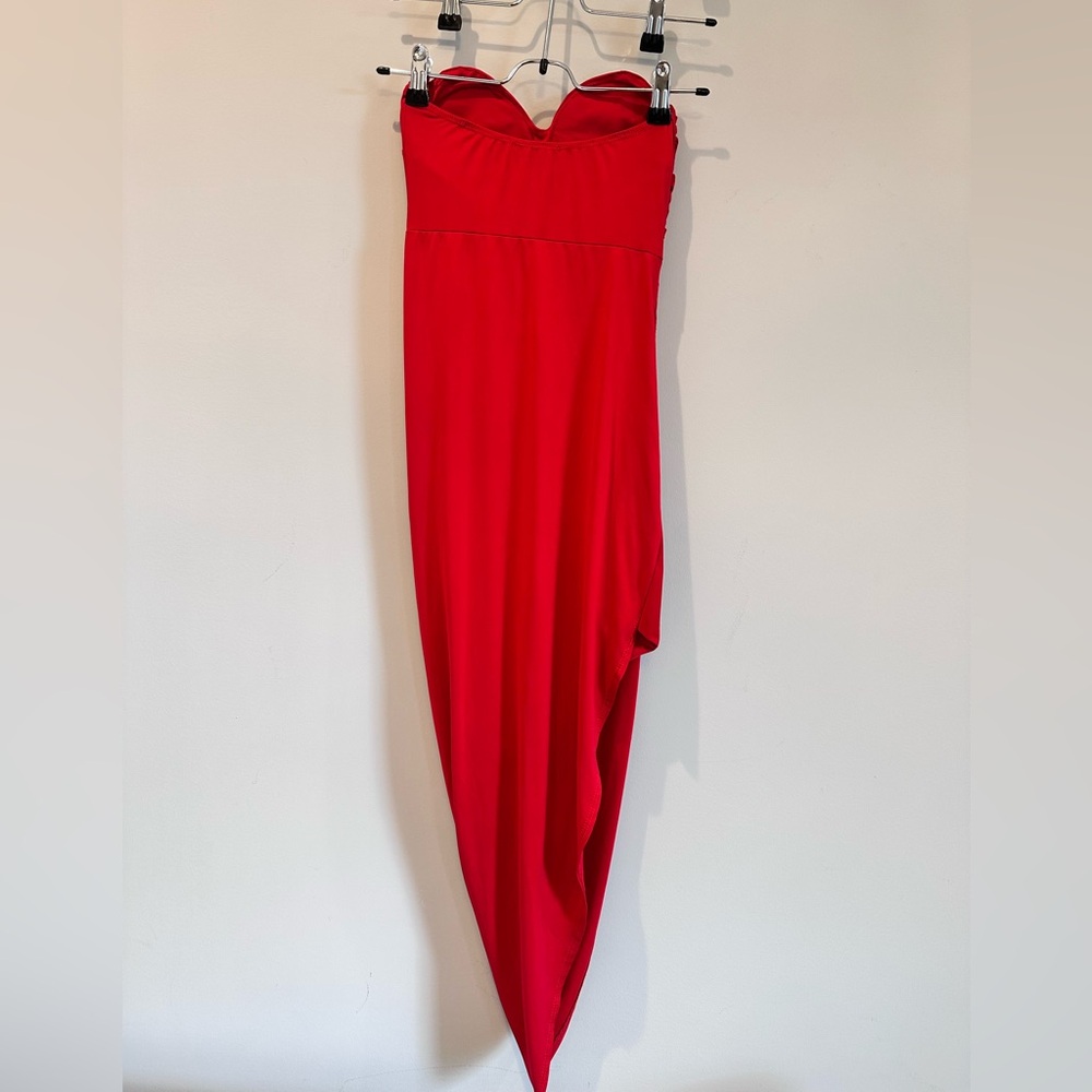 Red strapless dress, built-in padding for support and stretchy. Size XS